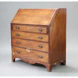 A Georgian mahogany bureau with crossbanded and fall front revealing a fitted interior above 3