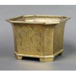 A Chinese polished bronze octagonal waisted planter engraved court figures, raised on panelled feet,