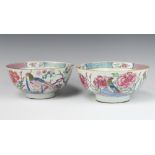 A pair of 18th Century famille rose bowls decorated with birds amongst flowers 20cm 1 is cracked