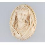 A Victorian carved ivory portrait brooch 6cm