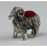 A sterling pin cushion in the form of a standing ram 3cm