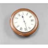 A Continental 8 day wall clock with 30cm dial, Roman numerals, contained in an oak case 41cm x 13cm
