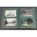 A red album of black and white and coloured postcards including local scenes, Broadwater, Devils