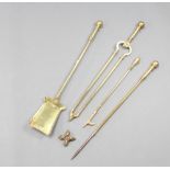 A Victorian brass 3 piece fireside companion set with poker, tongs and shovel together with a Adam