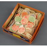 A collection of 1920's milk bottle tops