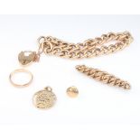 A 9ct yellow gold bracelet and padlock, a ditto stud and ring, 17.5 grams and a yellow metal brooch