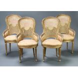 A set of 4 1920's gilt carved wood and plaster high back salon chairs with woven cane panels and