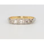 An 18ct yellow gold 5 stone illusion set diamond ring, 2.8 grams, size N