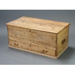 A Victorian pine mule chest with hinged lid, interior fitted a candle box and with iron handles to