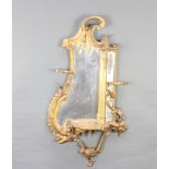 A Chippendale style plate mirror contained in a decorative frame fitted a shelf 80cm x 44cm