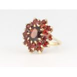 A 9ct yellow gold garnet cluster ring 4.8 grams, size K 1/2