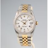 A lady's Rolex Oyster perpetual datejust wristwatch with diamond dot hours and a diamond bezel,