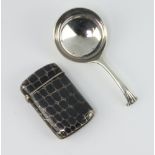 A niello leather effect vesta 4.5cm, a white metal caddy spoon with scroll end