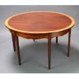 A Georgian dining table base with later crossbanded mahogany oval top, the base having 8 square