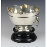 An Edwardian silver monteith with mask rim and lion drop handles, London 1905, 15cm, 600 grams,