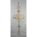 A Russian pierced gilt metal hanging cross surmounted by a double headed eagle 90cm x 109cm x 40cm