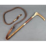 A hunting whip with stag horn grip, leather thong and lash