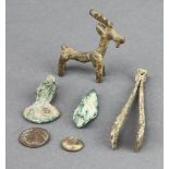 A bronze arrowhead, a Roman bronze spoon in the form of a bust, 2 coins, pair of tweezers and a