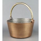 A polished brass preserving pan with swing handle 60cm x 28cm