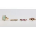 Four 9ct yellow gold gem set rings, size L, L, M and P, 9.5 grams