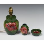 A contemporary green ground table lamp decorated hibiscus 16cm, ditto vase 10cm and a dish 8cm