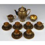 An Art Deco Carlton Ware black and gilt speckled coffee set comprising coffee pot, sugar bowl, 6