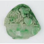 A Chinese carved apple green jadeite pendant in the form of a woven basket of fruit and flowers 6cm