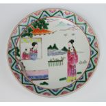 A Japanese shallow dish decorated with a lady before a pavillion and attendants 25cm