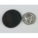 A Roman silver coin - Vespasian 69-79 AD and a bronze coin Claudius I 41-42