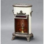A Petrolux iron and white enamelled oval twin handled stove, raised on panel supports 67cm h x