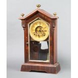 A 19th Century American striking shelf clock with 11cm paper dial with Roman numerals and visible