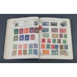 A blue Improved stamp album of used world stamps including GB, Victoria and later, France, Poland