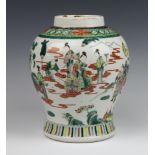A late 19th Century Chinese famille verte oviform baluster vase decorated with a procession of