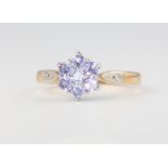 A 9ct yellow gold tanzanite and diamond cluster ring 2.7 grams, size P