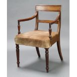 A Georgian mahogany bar back carver/desk chair with plain mid rail, raised on turned supports 86cm h