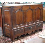 A 17th/18th Century oak mule chest with hinged lid, the base fitted 3 drawers 97cm h x 138cm w x