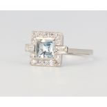 A platinum Art Deco style aquamarine and diamond ring, the centre stone approx. 0.75ct surrounded by