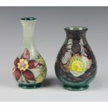 Moorcroft, a contemporary baluster vase decorated the Seasons pattern 13cm, a pale blue ground ditto