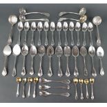 Twelve silver plated lily pattern grapefruit spoons, 11 mixed condiment spoons, 6 sifter spoons,