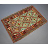 A yellow, green and turquoise ground Chobi Kilim rug 151cm x 103cm