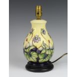 Moorcroft, a contemporary baluster shaped yellow ground Hepatica pattern table lamp 27cm