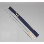A Hardy graphite 7'6" fly fishing rod with 4/5 line weight in a blue cloth bag