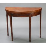 A 19th Century mahogany demi-lune and crossbanded card table raised on square tapered supports,