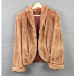 A light mink quarter length fur jacket One cuff seam is coming undone