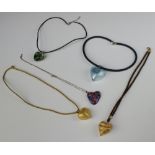 Five decorative glass pendant necklaces