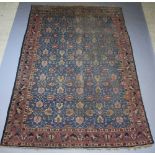 A blue, pink and green ground Persian carpet with all over floral design 387cm x 263cm Heavily