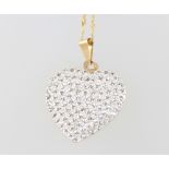 A 9ct yellow gold paste set heart pendant and chain together with a 9ct necklace with baroque