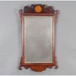 A 19th Century rectangular bevelled plate Chippendale style wall mirror contained in a shaped