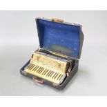 A Vickers Super Special accordion with 121 buttons (some cracked) complete with carrying case