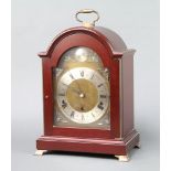 Elliott, a reproduction Georgian style bracket clock with arched gilt dial and silvered chapter